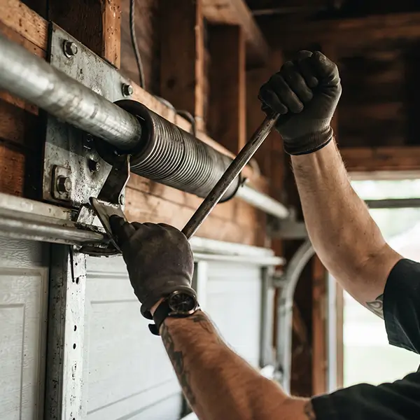 Garage Door Kemah technician inspecting garage door spring in Kemah Texas